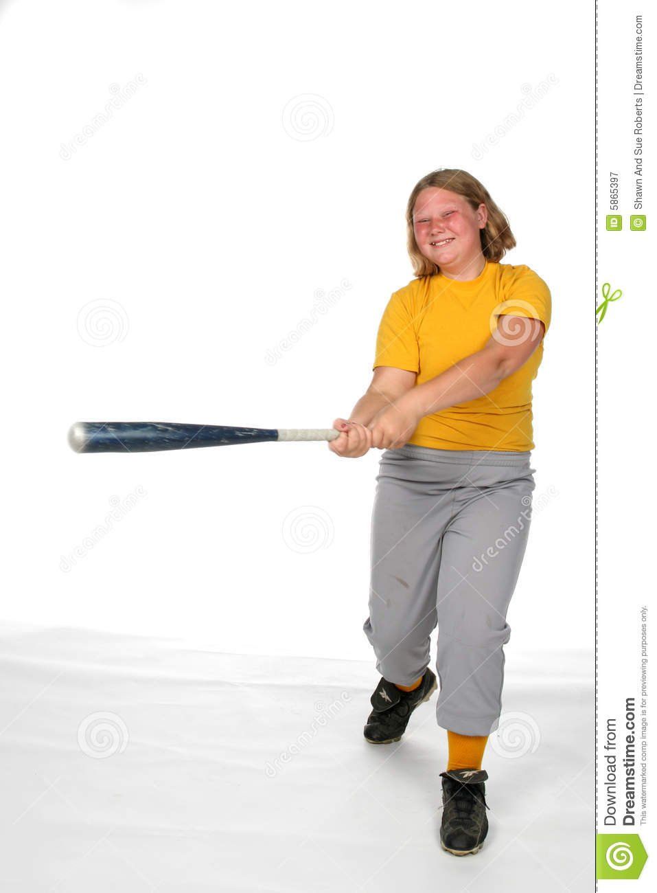 Girl swinging a baseball bat