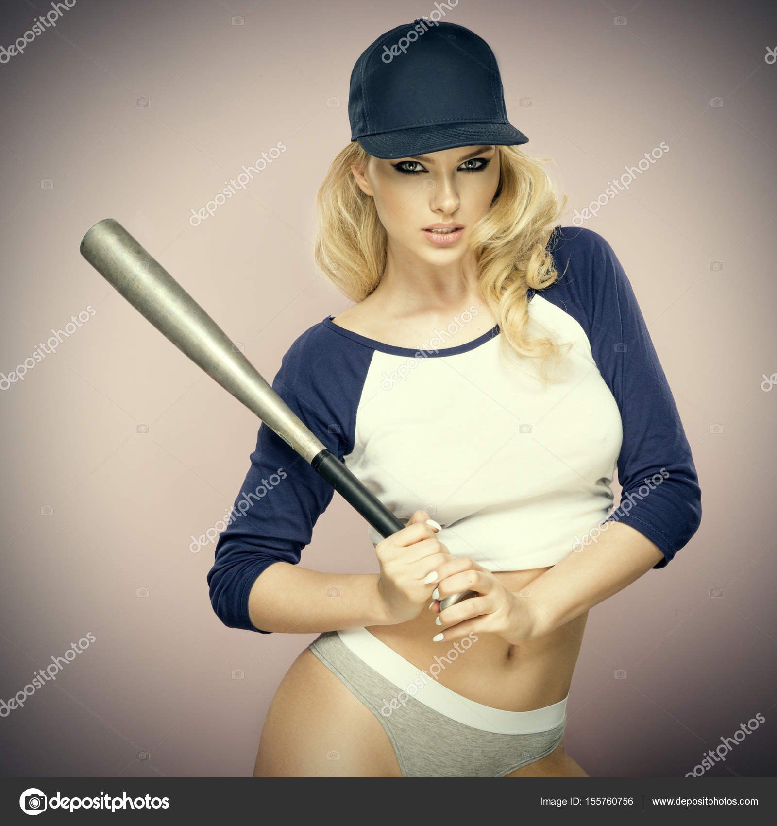 First D. reccomend Girl swinging a baseball bat