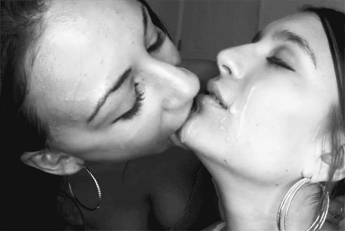 Licking cum off her face